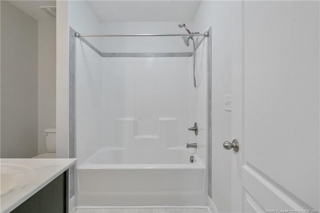 full bathroom featuring bathtub / shower combination, vanity, and toilet