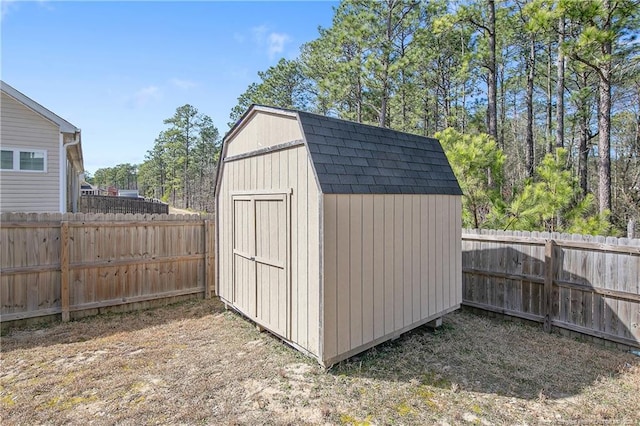 view of shed with a fenced backyard