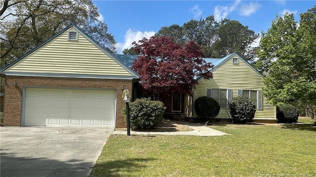 107 Oakmont Dr, Clinton, NC 28328 - view of front of home featuring driveway, an attached garage, and a front yard
