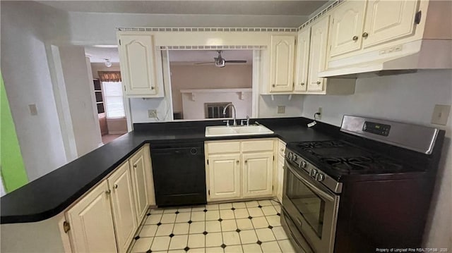 107 Oakmont Dr, Clinton, NC 28328 - kitchen with stainless steel gas range, dark countertops, black dishwasher, and a sink
