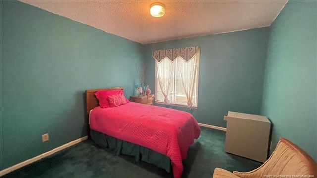 107 Oakmont Dr, Clinton, NC 28328 - carpeted bedroom featuring baseboards and a textured ceiling