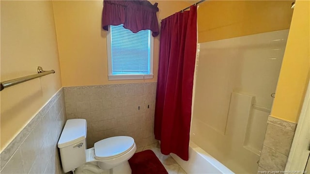 107 Oakmont Dr, Clinton, NC 28328 - bathroom with toilet, shower / bath combo, tile walls, and wainscoting