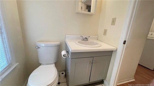 107 Oakmont Dr, Clinton, NC 28328 - bathroom featuring toilet, vanity, and washer / clothes dryer
