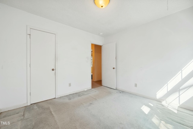 unfurnished bedroom featuring carpet flooring