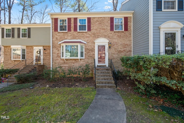 townhome / multi-family property with brick siding