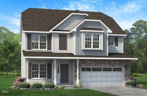 view of front of home with board and batten siding, concrete driveway, stone siding, and an attached garage