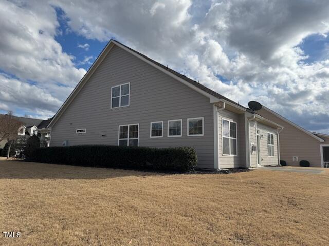 view of home's exterior featuring a yard