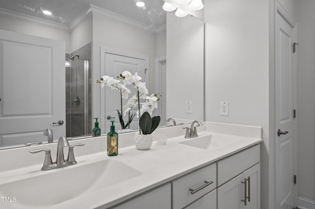 full bathroom with crown molding, double vanity, a stall shower, and a sink