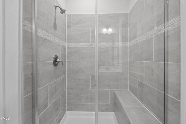 bathroom with a shower stall