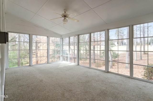 unfurnished sunroom featuring vaulted ceiling and a ceiling fan