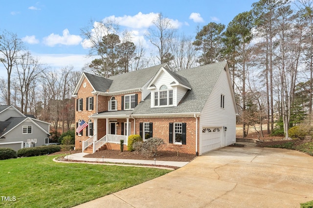 view of front of property with brick siding, concrete driveway, covered porch, an attached garage, and a front yard