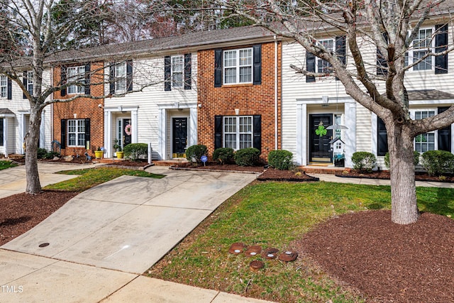 view of front of property featuring brick siding