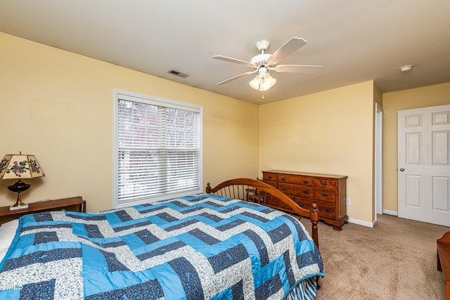 bedroom with light carpet, baseboards, visible vents, and a ceiling fan