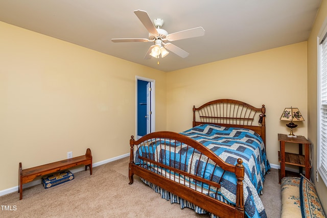 bedroom with carpet floors, a ceiling fan, and baseboards