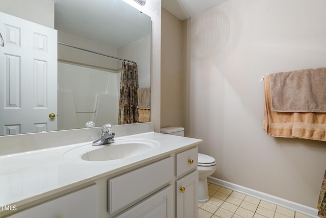 bathroom featuring toilet, vanity, a shower with curtain, baseboards, and tile patterned floors