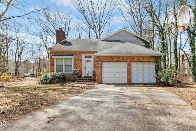 view of front of home featuring driveway, an attached garage, a shingled roof, a chimney, and brick siding