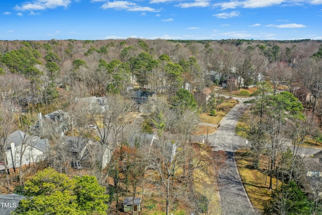 drone / aerial view with a view of trees