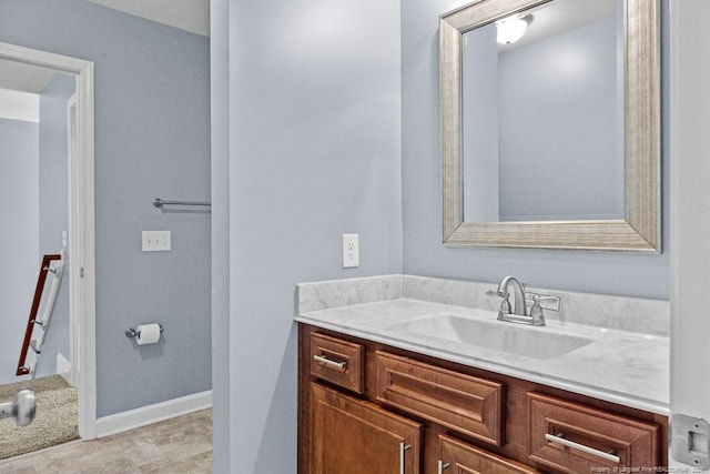 bathroom featuring vanity and baseboards