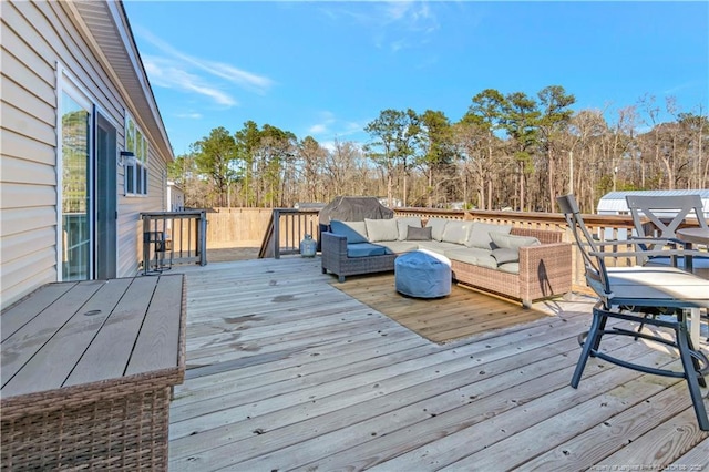 deck with fence and an outdoor living space