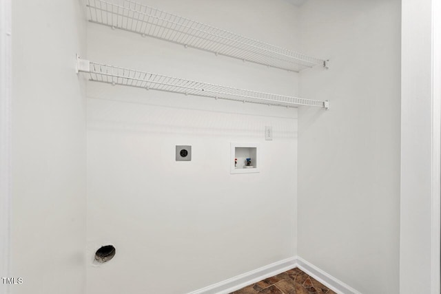 clothes washing area featuring laundry area, hookup for a washing machine, baseboards, and hookup for an electric dryer