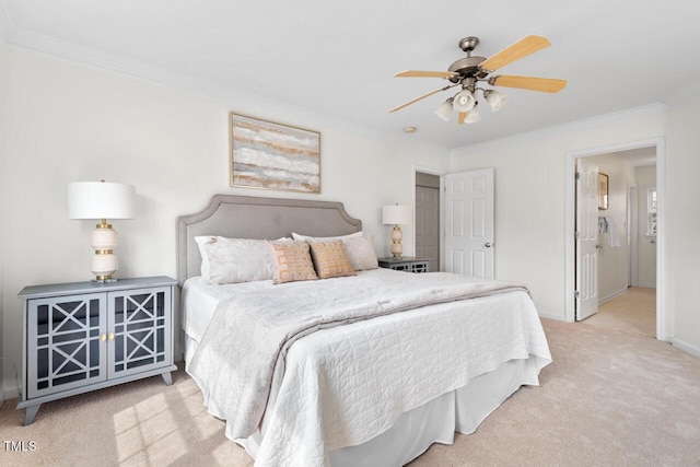 carpeted bedroom featuring ceiling fan, baseboards, and ornamental molding