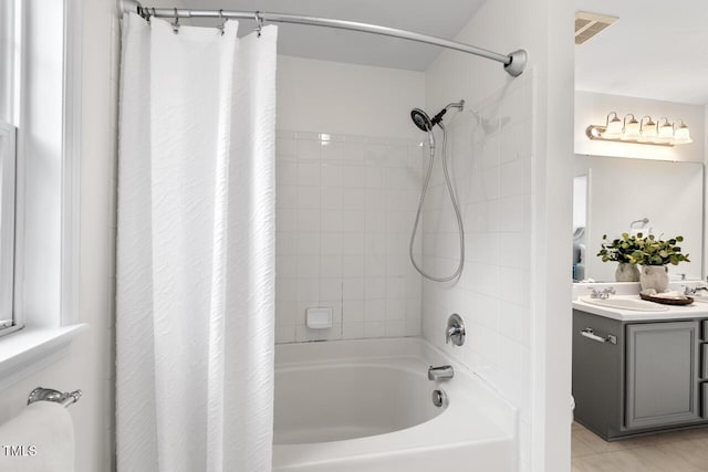 full bathroom with shower / bathtub combination with curtain, visible vents, and vanity