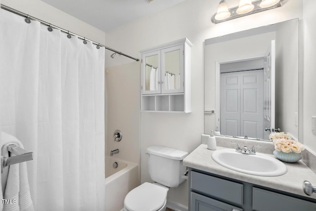 full bathroom with shower / tub combo, toilet, and vanity