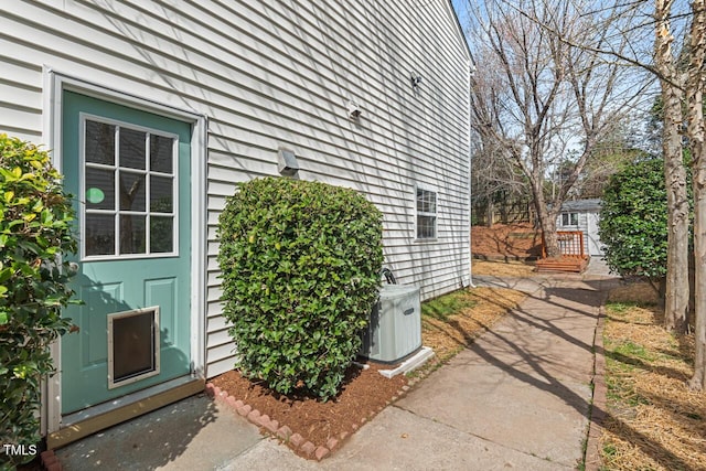 view of exterior entry featuring central AC