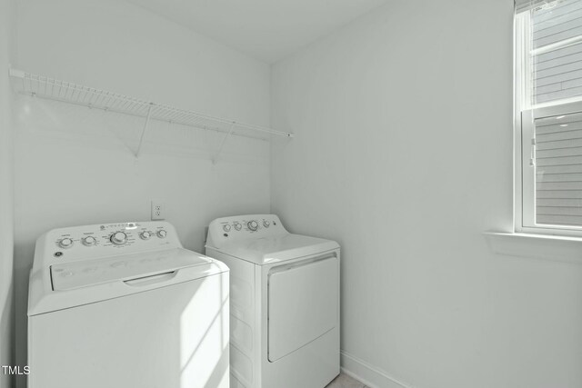 laundry area featuring laundry area and washer and clothes dryer