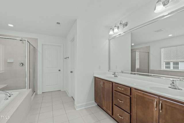 bathroom featuring a garden tub, double vanity, a sink, and a shower stall