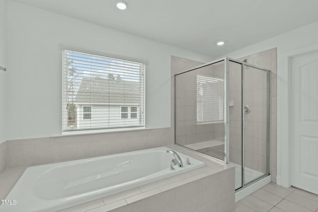 bathroom featuring a stall shower, recessed lighting, a bath, and tile patterned floors