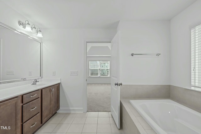 bathroom featuring tile patterned flooring, a garden tub, and a healthy amount of sunlight