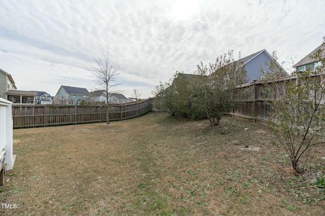 view of yard with a fenced backyard