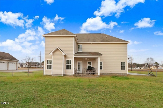 back of house featuring a yard, a patio, and ceiling fan