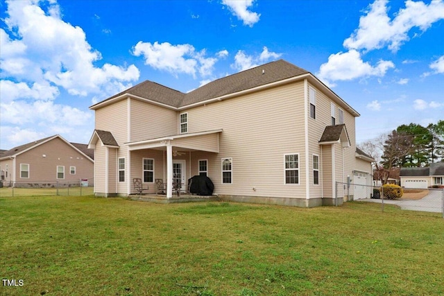 back of house with ceiling fan, a patio area, a lawn, and fence