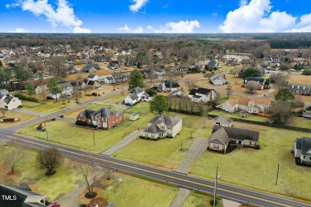 birds eye view of property with a residential view