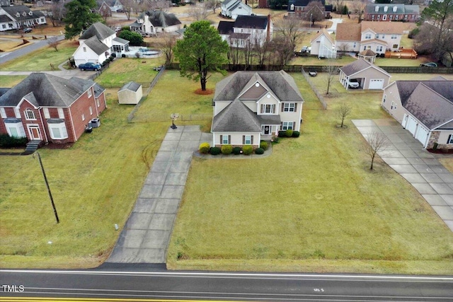 birds eye view of property with a residential view