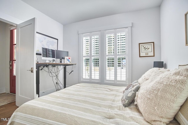 bedroom featuring wood finished floors