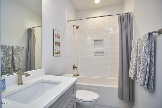 full bathroom with toilet, shower / tub combo with curtain, and vanity