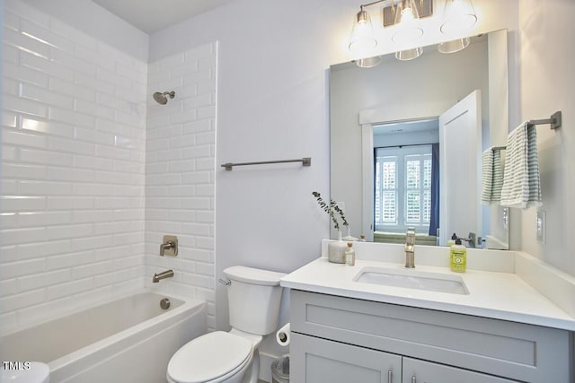 full bath featuring toilet, bathing tub / shower combination, and vanity