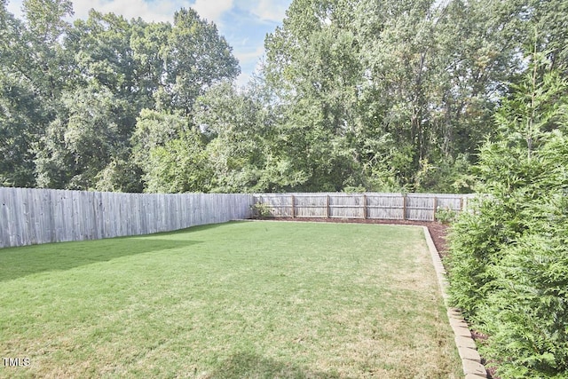 view of yard featuring a fenced backyard