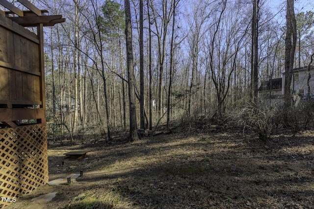 view of yard featuring a view of trees