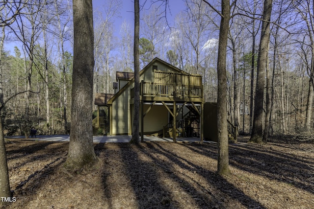 back of property with a wooden deck