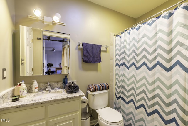 full bath with a shower with shower curtain, toilet, and vanity