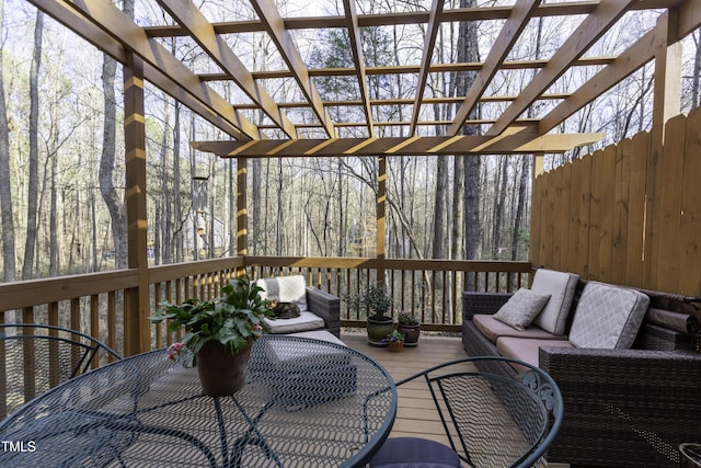 wooden deck featuring a pergola and an outdoor hangout area