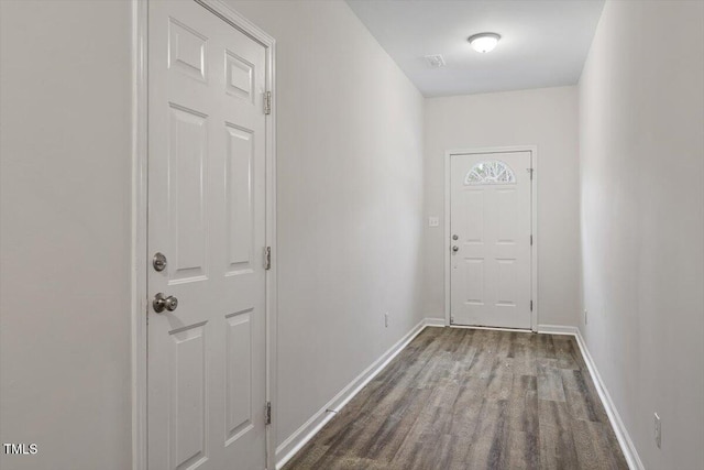 entryway featuring wood finished floors and baseboards