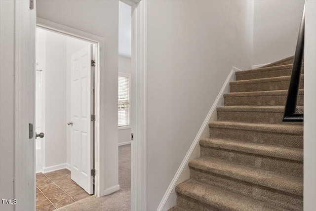 stairway with baseboards