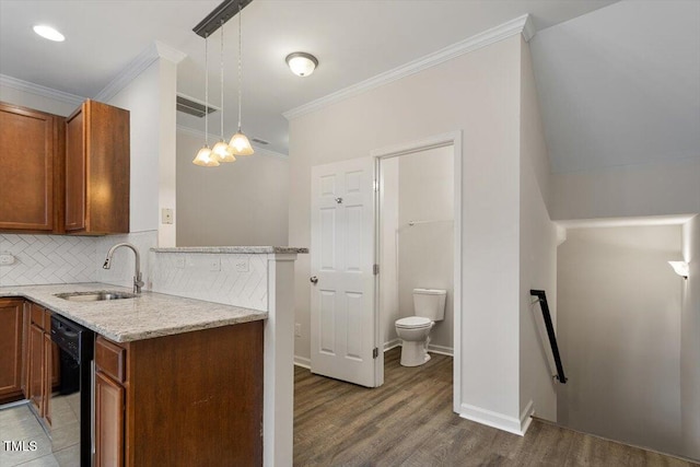 kitchen featuring tasteful backsplash, visible vents, ornamental molding, a sink, and dishwasher