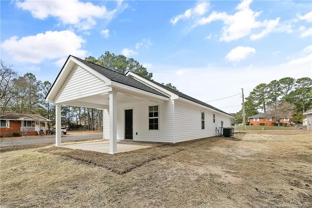 back of property featuring central AC and a patio area