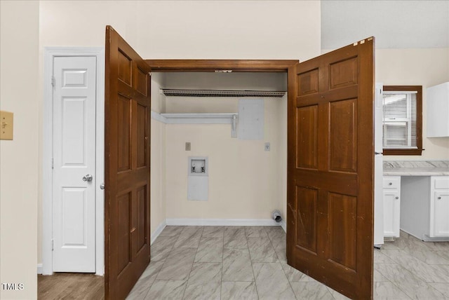 laundry area with laundry area, baseboards, marble finish floor, hookup for a washing machine, and electric dryer hookup